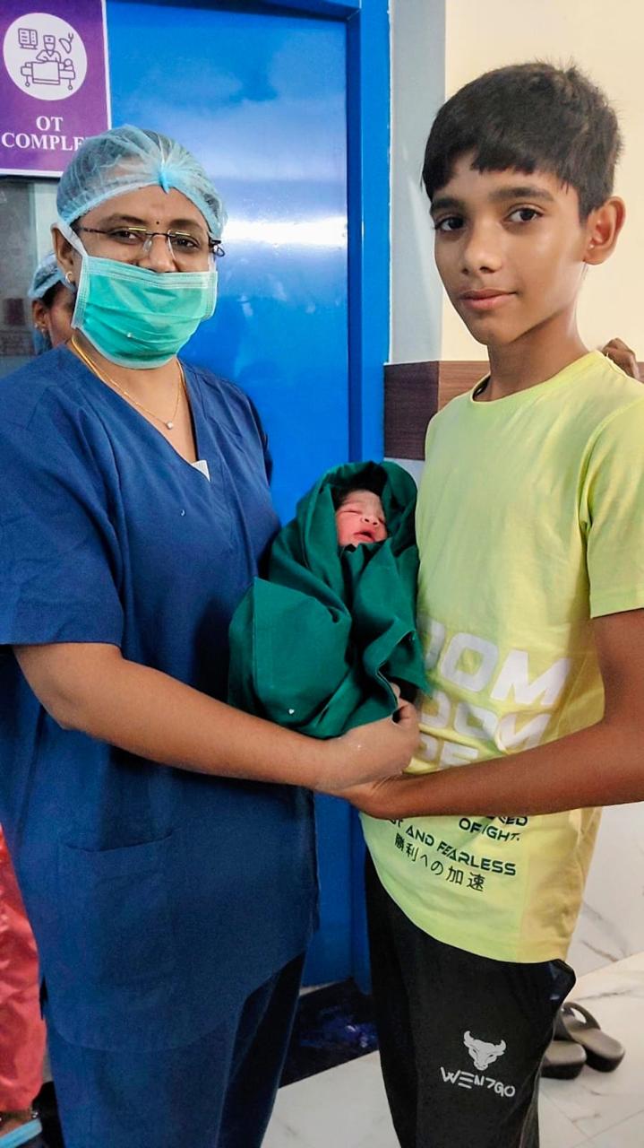 Newborn meeting his elder brother outside the OT at Sri Sai Clinic & Scans